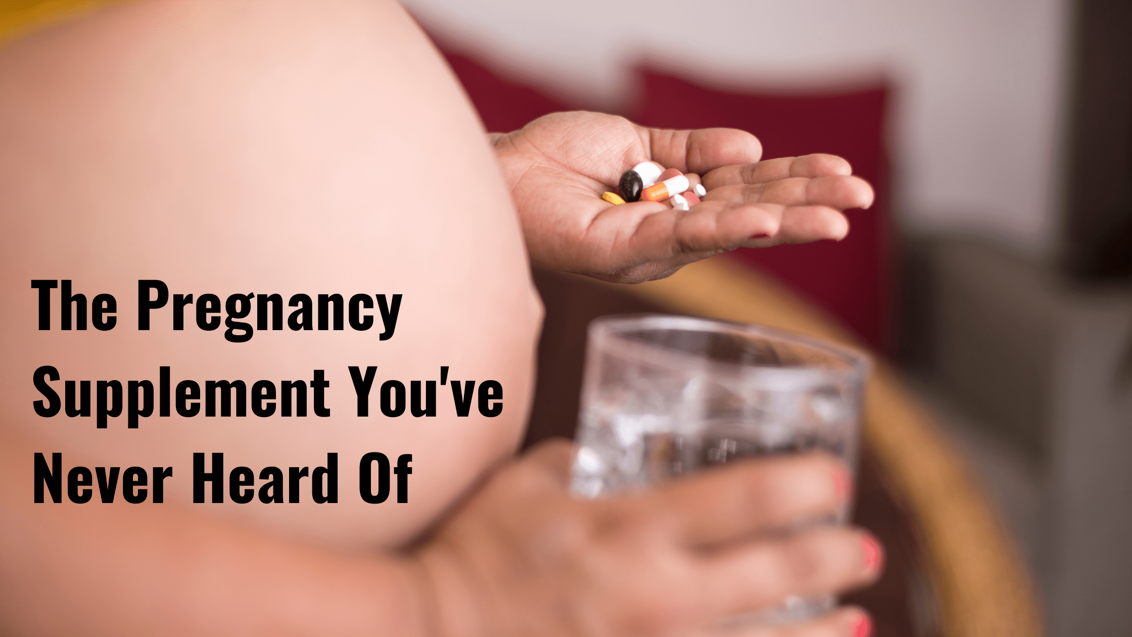 pregnant lady holding vitamins