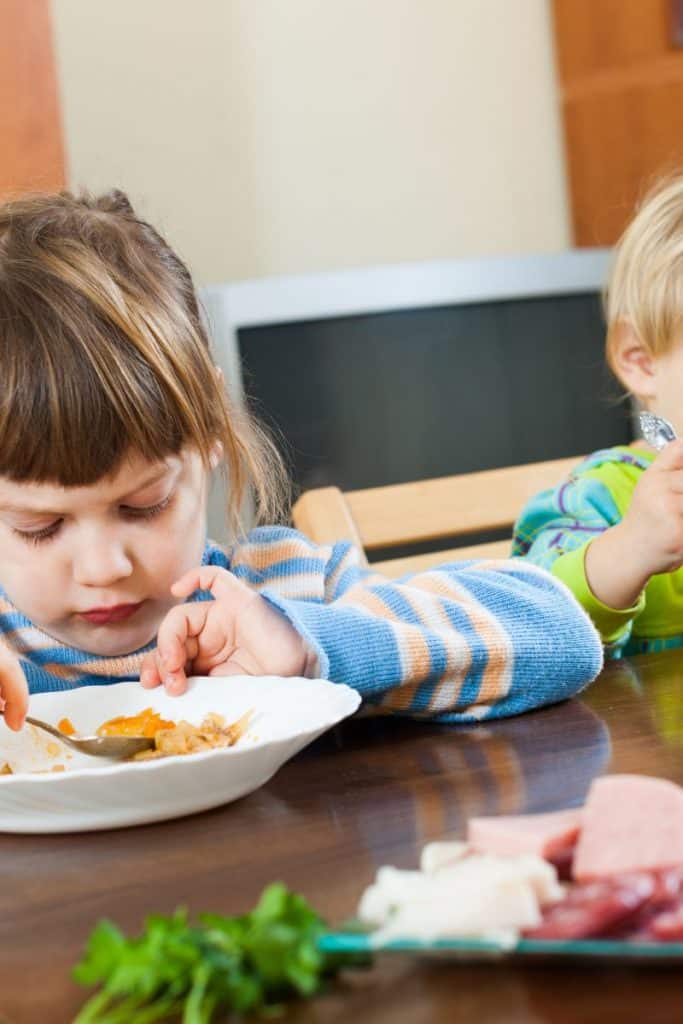 child eating at table
