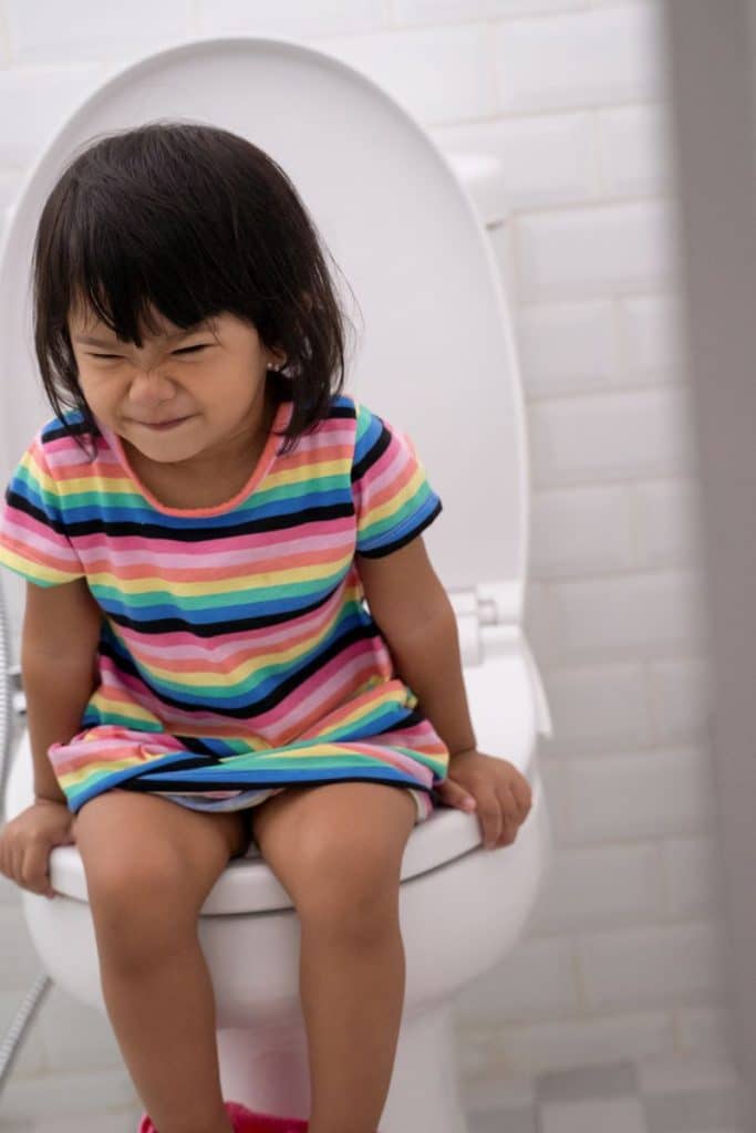 little girl straining on toilet